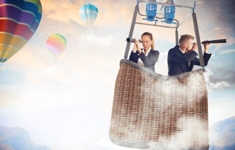 business people rising in a balloon searching for skills